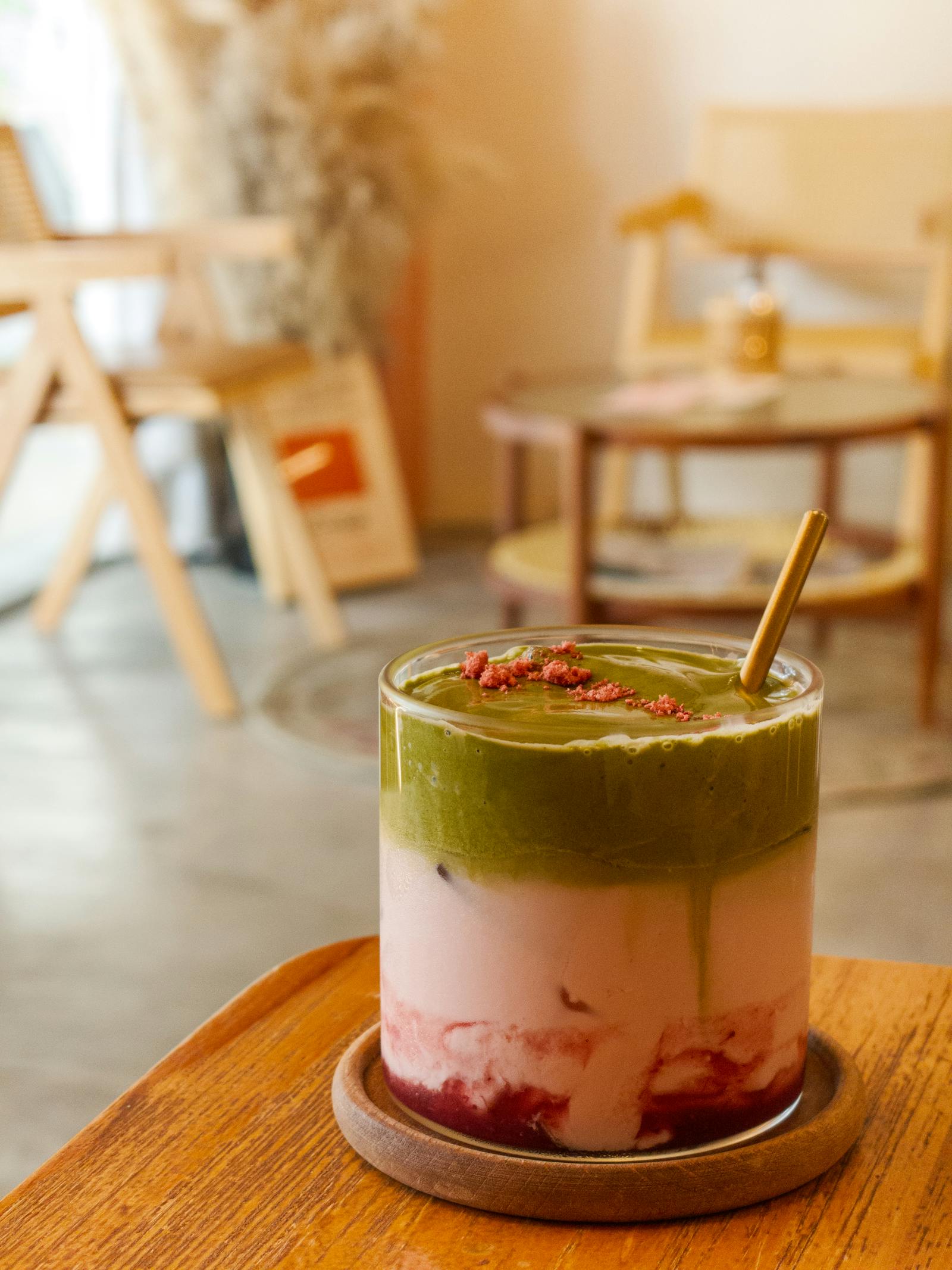 Strawberry matcha on a wooden table in a calm café interior